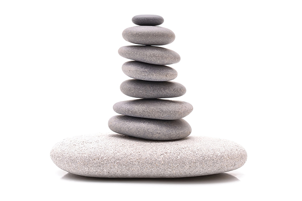 An image of gently balanced stacked stones.