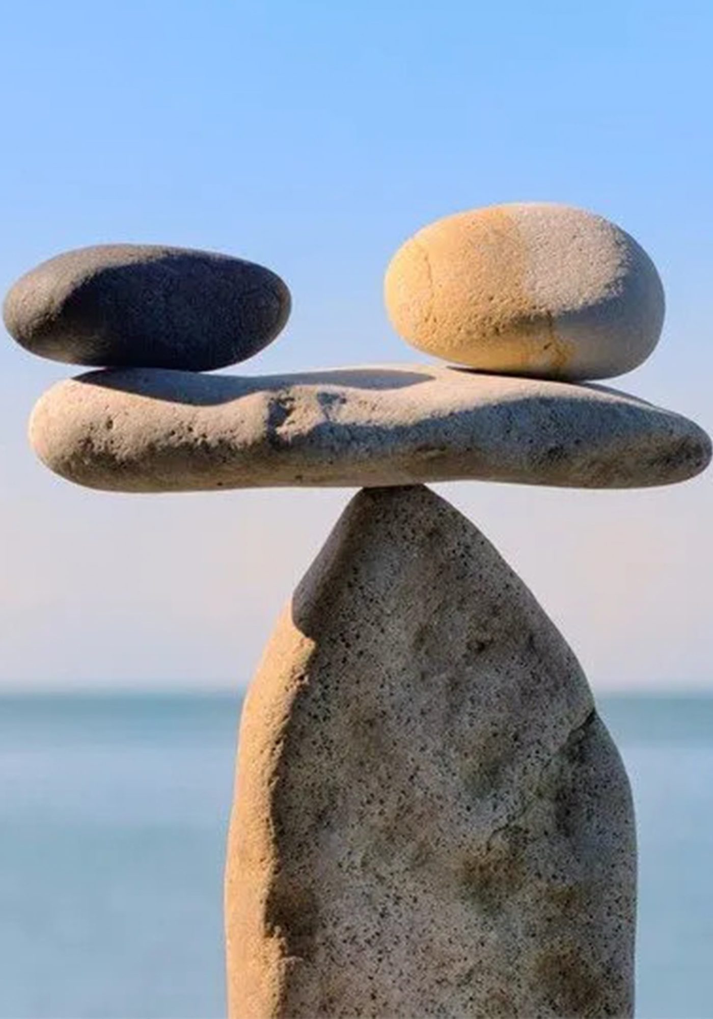An image of gently balanced stacked stones.