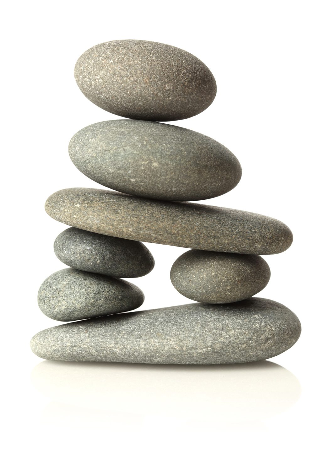 An image of two gently balanced stacked stones working together to hold up an arch.